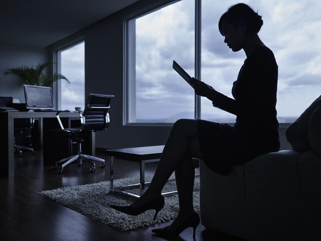 Pullman Kuching Hotel Ngoại thất bức ảnh A woman working in a dark office